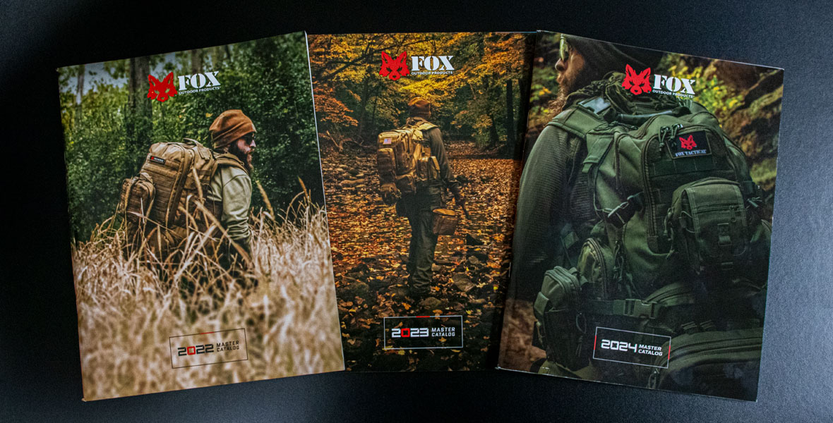 Image of the past three years Fox Outdoor Product's Catalog on a table.