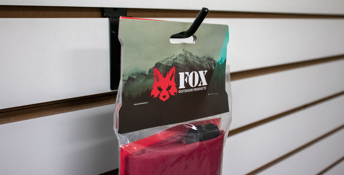 Dry Bag header card hanging on hook with product in bag.